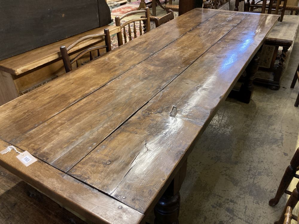 An 18th century style oak refectory dining table, 240 x 83cm height 76cm
